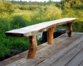 Rustic pine bench top and legs on deck